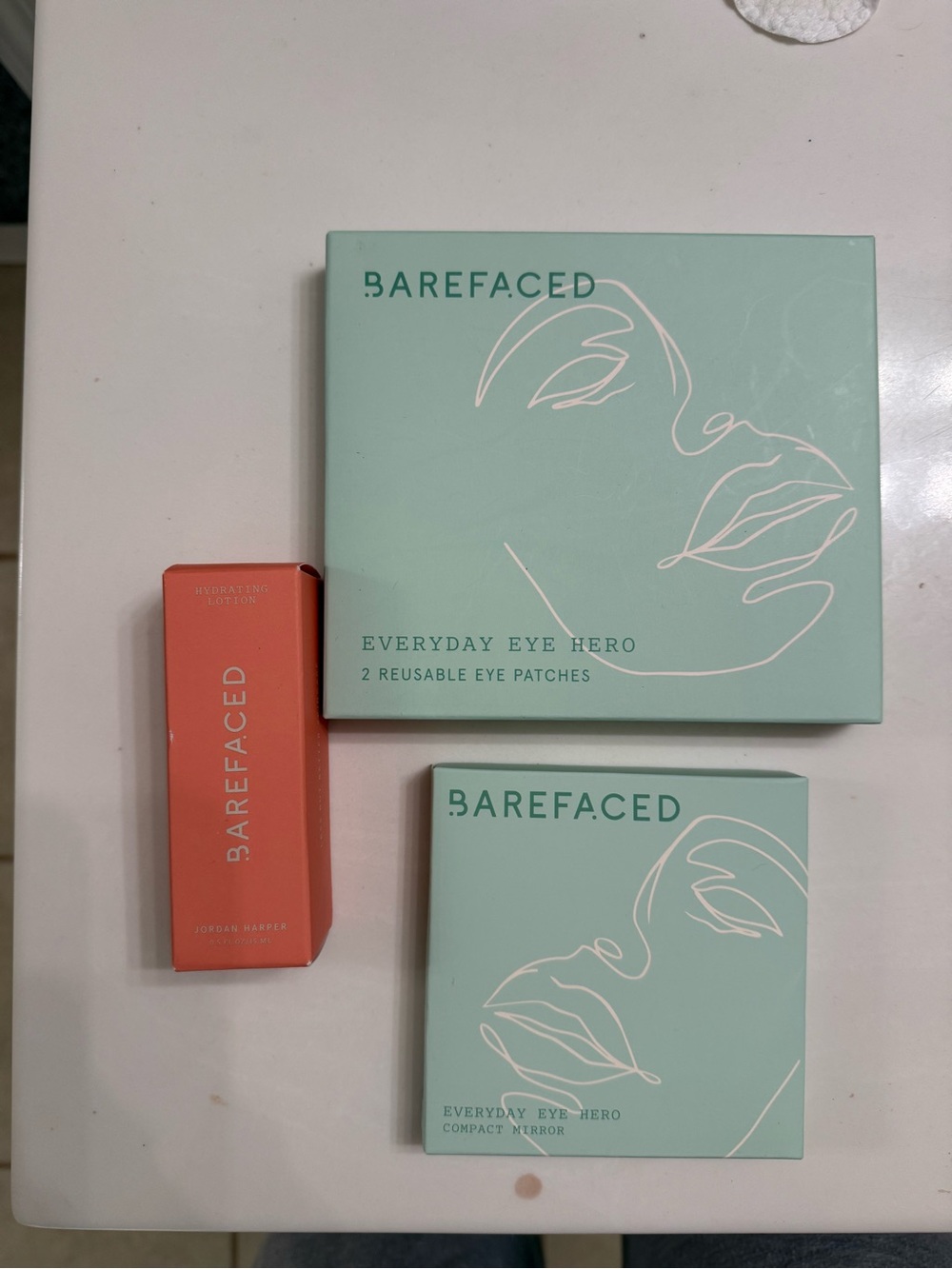 Barefaced lotion and reusable eye patches and compact mirror. Brand new in box.